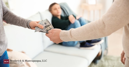 man giving money to woman