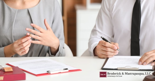 couple signing divorce papers